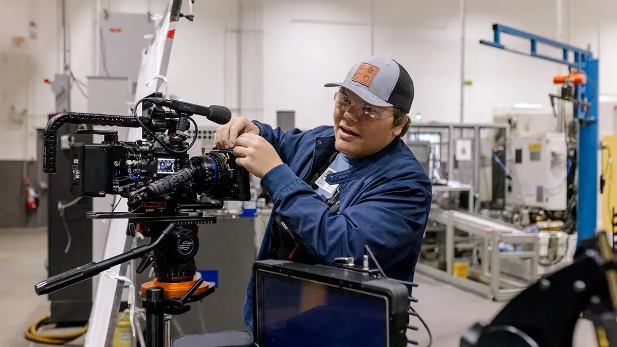 a Charter & Co camera operator preps film gear for a social media video production