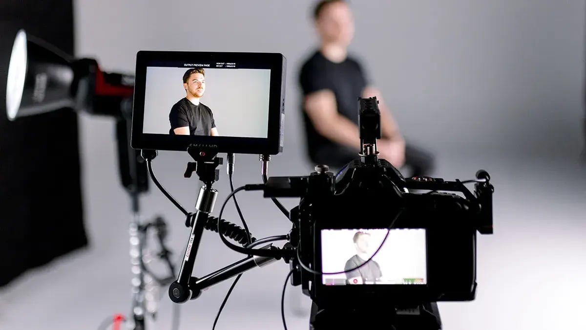 a camera films an interview during a video marketing production for a brand